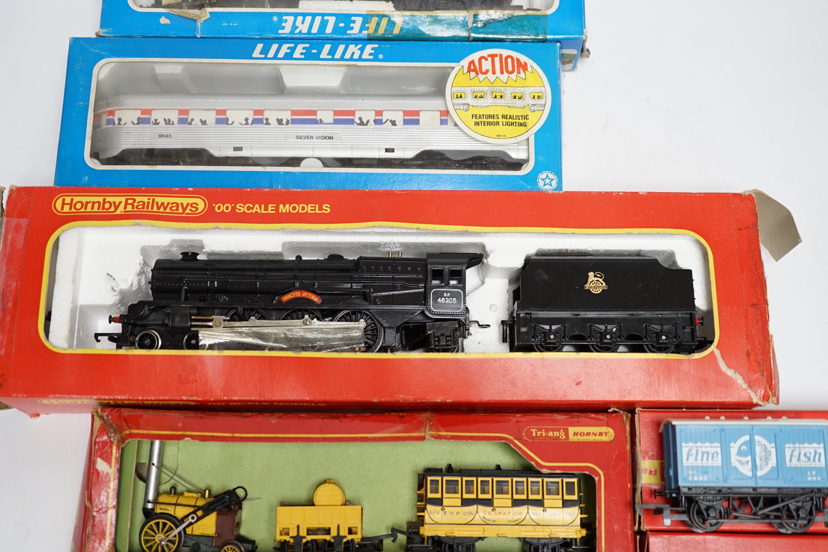 Eight items of 00 and HO gauge model, railway, including; a Tri-ang Stevenson’s Rocket set (R346), a Hornby Railways Princess Class locomotive (R050), An Amtrak diesel locomotive, and three coaches, etc.